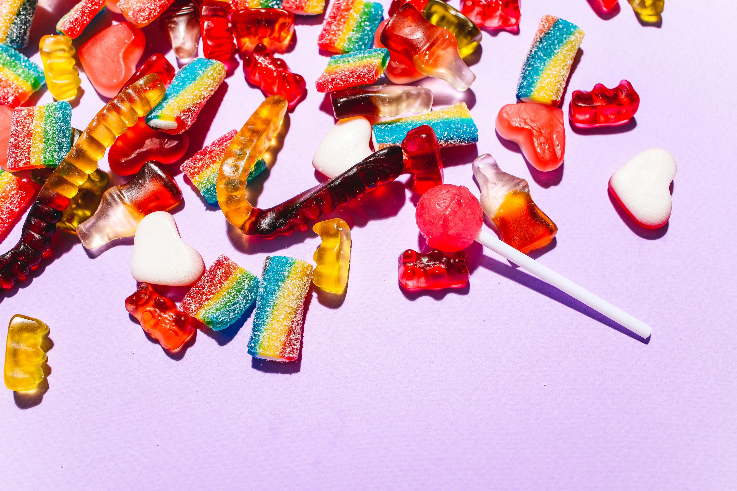 Assorted candy mix in colorful bowls